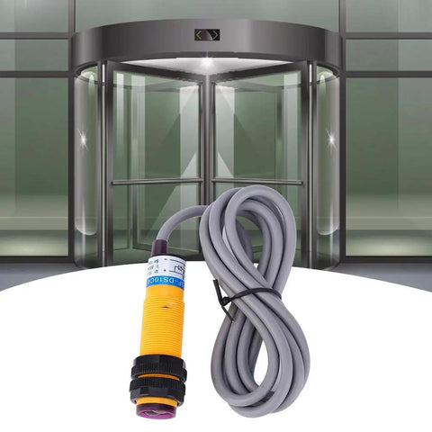 JYIO 10 Pack Infrared Photoelectric Switch Diffuse Reflection Sensor in front of automated door, featuring rugged 1.1m cable