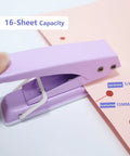 Heavy Duty Quarter Inch Hole Puncher For Paper And Crafts, handheld, 16 sheet capacity, showing lever action on pink paper