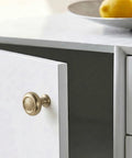 Single knob from Set Of Six Champagne Bronze Cabinet Knobs In Zinc Alloy Modern Hardware on white cabinet door