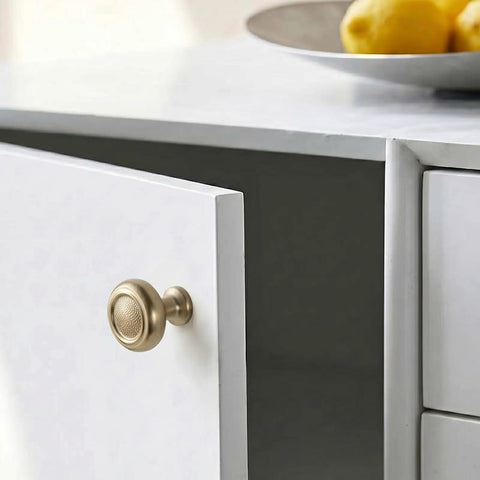 Single knob from Set Of Six Champagne Bronze Cabinet Knobs In Zinc Alloy Modern Hardware on white cabinet door