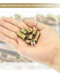 Close-up of hand holding steel nut inserts from 152 Piece Threaded Inserts Set For Wood, 1/4-20 and 5/16-18, DIY kit