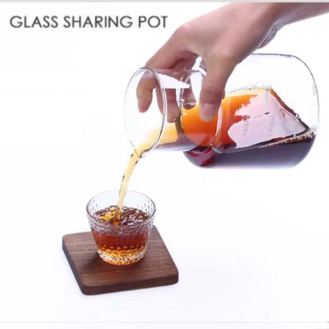 Premium Stainless Steel And Borosilicate Glass Cold Brew Coffee Maker Featuring Rapid Drip System For Smooth Ice Coffee In Four Hours Zero Hassle Vibes Next Level Kitchen Essential pouring coffee into a textured glass cup.