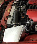 Fiberglass Heat Shield Tape with Aluminum Backing installed in car engine bay for extreme heat protection, 12x48 inch sheet