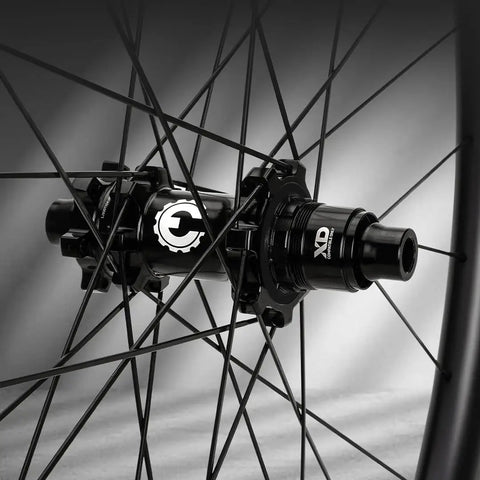 Close-up of hub on 29er Carbon MTB Wheelset 36mm Wide Hand Built Wheel For Trail And Enduro Rides Bombproof Tubeless Ready Design With URT Resin Tech