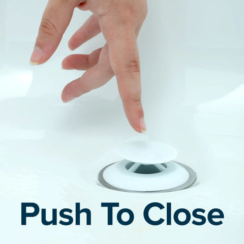 Hand pressing Slick Snap Shut Tub Drain Stopper For Standard 1.5 Inch Open Bathroom Drains Easy Peasy Push Valve Plug.