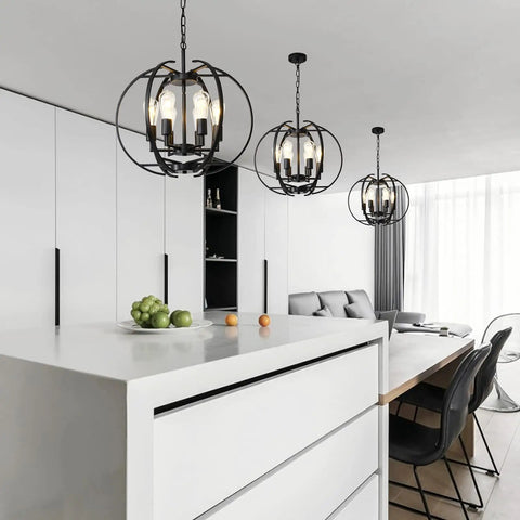 Black Globe Pendant Lights With Six Lights in modern kitchen interior, adjustable ceiling hanging chandeliers above island.