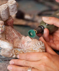 Using 80Pcs 1In Rotary Tool Buffing And Polishing Wheel Set with 25mm Abrasive Wheels and 3mm Shank on a wooden sculpture