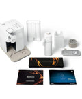 One Touch Automatic Milk Coffee Brewer With Integrated Frother For Barista Level Espresso And Smooth Morning Kick Premium White Finish Single Serve Capsule Compatible Home Brewing Setup For Reliable Daily Java Rituals with accessories and user manuals.