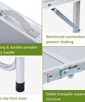 Close-up of Foldable Camping Table With Storage showing the carry handle, anti-slip foot mats, reinforced connections, and support structure.