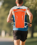 Runner wearing orange Hydration Pack For Runners Lightweight Hydration Backpack With Water Reservoir And On The Go Hands Free Sip Valve