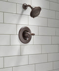 Linden 14 Series Shower Trim Kit With 5 Spray Touch Clean Shower Head in Venetian Bronze mounted on white tile wall