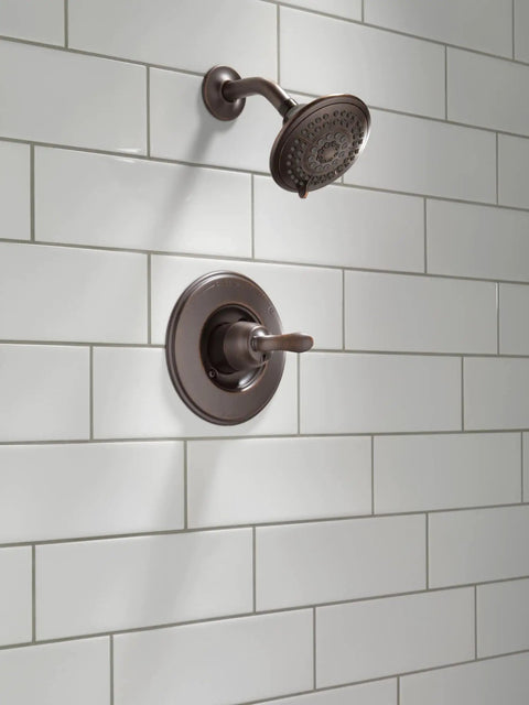 Linden 14 Series Shower Trim Kit With 5 Spray Touch Clean Shower Head in Venetian Bronze mounted on white tile wall