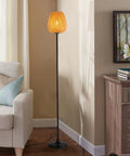 Japanese Style Bamboo Floor Lamp with Handwoven Rattan Shade, modern tall standing light with industrial black metal legs, in living room.