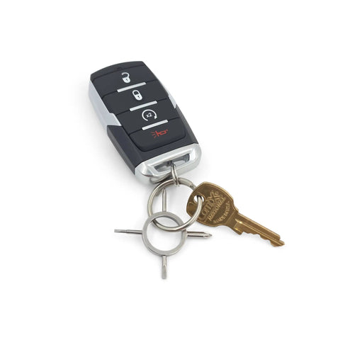 Pocket EDC 4 In 1 Screwdriver For Glasses Sunglasses And Small Electronics With Flat And Phillips Heads Lightweight Hardened Steel Mini Repair Tool On Your Everyday Carry Key Ring next to a car key on a white background