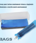 Disposable Tattoo Machine Covers Pack Pro Grade 200 Pcs 2.4 Inch By 7 Inch Blue Sleeves shown with open box and covered pen