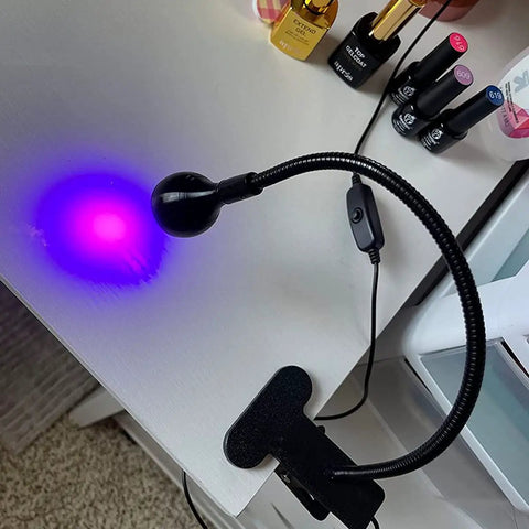 3W 395Nm UV Black Light with Flexible Gooseneck illuminating surface, USB powered, for art and fluorescent paints use.