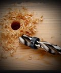 Drill Stop Bit Collar Set With Allen Wrench For Tight Precise Drilling Seven Piece Kit in wooden block with drilled hole and wood shavings