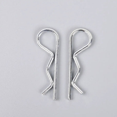 Close-up of R Shape Cotter Pins Set 150 Pieces Carbon Steel Small Metal Spring Pins on a plain background.
