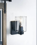 Industrial farmhouse matte black wall sconce with clear glass shade, ideal for bathroom mirror, hallway lighting, bulb not included.