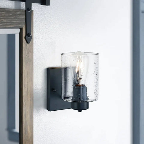 Industrial farmhouse matte black wall sconce with clear glass shade, ideal for bathroom mirror, hallway lighting, bulb not included.
