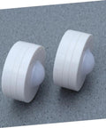 Close-up of two round lights from Six Pack LED Cabinet Lights Set With Dimmable Warm White Under Cabinet Lighting For Cupboards Kitchen And Office Use Touch Control Dimmer And Easy Install For Adjustable Brightness.