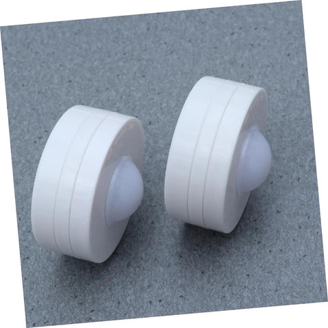 Close-up of two round lights from Six Pack LED Cabinet Lights Set With Dimmable Warm White Under Cabinet Lighting For Cupboards Kitchen And Office Use Touch Control Dimmer And Easy Install For Adjustable Brightness.