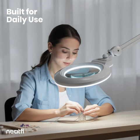 Woman using XL Bifocal LED Magnifying Lamp With 7 Inch Acrylic Lens 2.25x And 6x Magnification, 1600 Lumens Dimmable for crafting