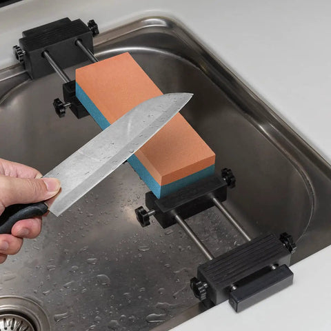 Adjustable Whetstone Stone Holder With Non Slip Base For Secure Knife Sharpening in use on a kitchen sink