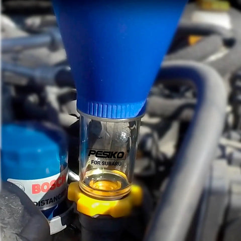 Spill Free Hands Free Engine Oil Funnel for Subaru vehicles with threaded cap installed for easy mess-free oil change.