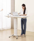 No Sweat Adjustable Height Rolling Drafting Desk With Flip Top And Book Stop Lightweight White Mobile Workstation Craft Table For Home Office in use.