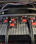 Professional Battery Management System Master Unit Managing Up To Eighteen Cells And Three Thermistors With Plug And Play Daisy Chaining And Weatherproof Can Bus Hookups For Domestic Ev Builds mounted on battery setup with wiring and labels.