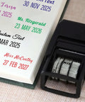 Custom Self Inking Date Stamp Personalized With Your Sign Off For Office And Business Gear Adjustable Date Wheel Stamps Through Twenty Thirty Five on a desk with printed dates.