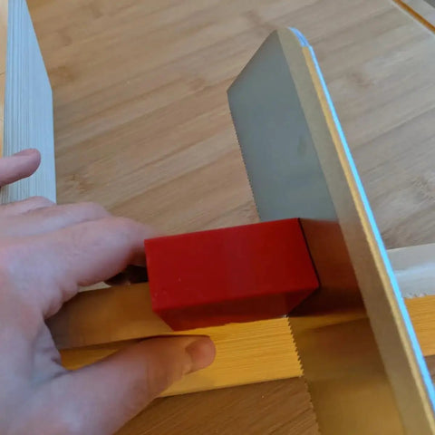 Game Changer Magnetic Pull Saw Guide compatible with Dozuki Ryoba and Kataba saws, demonstrating precision cutting with steady control.