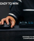 Top Shelf Tenkeyless Wireless Gaming Keyboard With Snappy Tactile Switches And Blazing Lightspeed Response For Crushing Every Ranked Match In Polished Black Frame, user gripping gaming mouse.