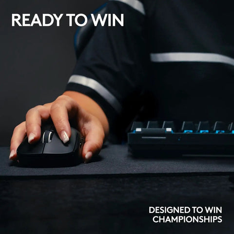 Top Shelf Tenkeyless Wireless Gaming Keyboard With Snappy Tactile Switches And Blazing Lightspeed Response For Crushing Every Ranked Match In Polished Black Frame, user gripping gaming mouse.