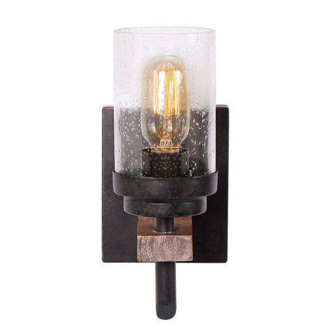 Rustic Wall Light Sconce With Seeded Glass Shade And Vintage Edison Bulb Look mounted on dark wood backplate