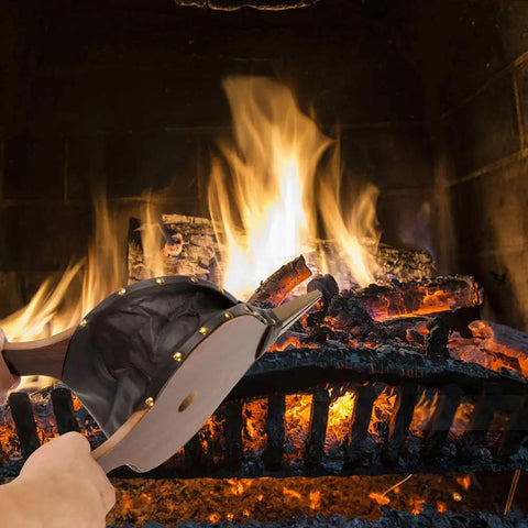 Large Wood Fire Bellows With Hanging Strap Cast Nozzle For Outdoor Camping And BBQ Grill Chimney Hand Pump Fireplace Tool Accessories Premium Leather Heat Resistant Durable Solid Wood Construction being used to stoke a fire in a fireplace