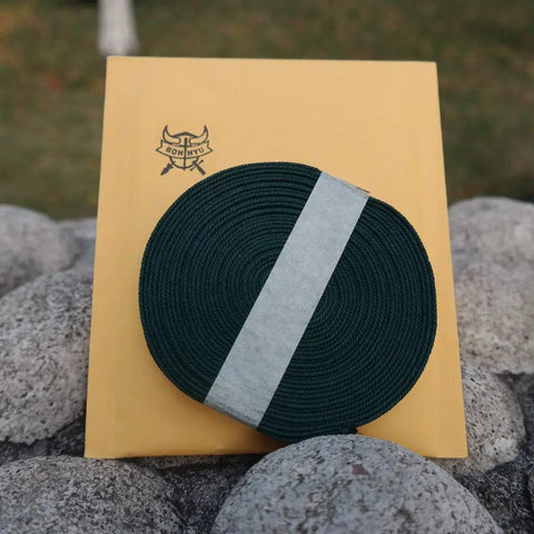 Durable Ito Sageo Wrapping Cord For Katana And Wakizashi 16.4 Foot Synthetic Silk on packaging outdoors on stones