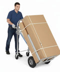 3 In 1 Heavy Duty Aluminum Hand Truck Cart With 550 Lb Capacity, Converts From Upright Stair Climb To Four Wheel Tilt, And Flat Platform Dolly For Appliances, Furniture, And Luggage, Folding Convenience. Man moving large boxed load on aluminum hand truck