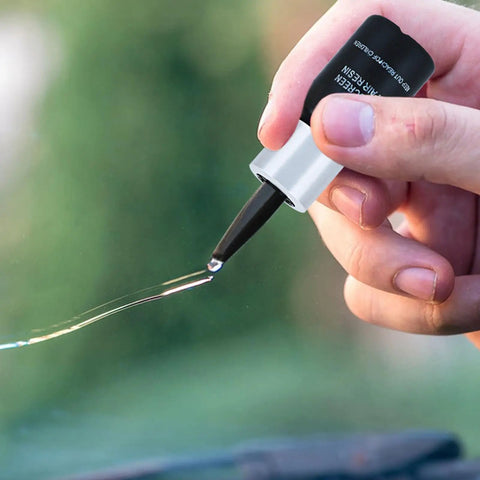 Applying resin from DIY Windshield Repair Kit For Chips And Cracks With Resin Glass Repair Fluid Quick And Easy Fix For Car Windshields
