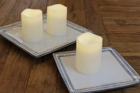 Outdoor IP44 Flameless LED Pillar Candles Set Of 3 With Remote And Timer Warm White Weather Resistant Plastic Candles That Wont Melt Waterproof 3 By 4 Inches Battery Operated on two plates