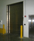 Slide On Yellow Bollard Post Cover For Warehouses Made From Durable Low Density Polyethylene Thermoplastic in loading dock area.