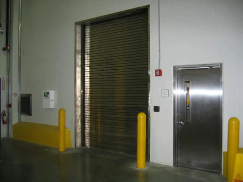 Slide On Yellow Bollard Post Cover For Warehouses Made From Durable Low Density Polyethylene Thermoplastic in loading dock area.