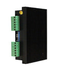 DM556 CNC digital stepper driver module with green terminal blocks and blue DIP switch on black finned heatsink (side view)