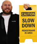 Caution Slow Down Pedestrians In Area Folding Floor Sign 25 By 12 Inches Plastic Black On Yellow Big And Bright Double Sided Durable Sign With Easy Carry Handle For Indoor Or Outdoor Use.