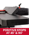 Detail of Badass Eight Inch Jointer Featuring Helical Cutterhead And Two Horsepower Motor with tilt fence showing positive stops at 45 and 90 degrees.