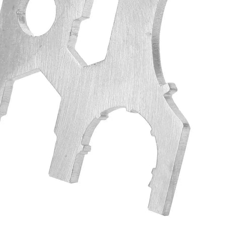 Close-up of geometric stainless steel scuba diving all in one multi tool kit for regulator repair, compact and lightweight.