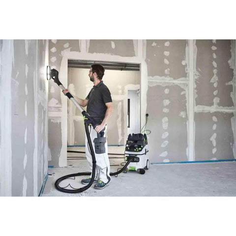 Person using PLANEX LHS 2 225 EQI Plus Drywall Sander With LED Ring Light Arm Friendly Adjustable Suction Power on drywall wall.