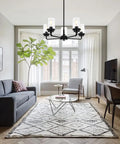 Living room with Dope Five Light Black Pendant Chandelier With Clear Glass Cylinder Shades And Gooseneck Arms For Dining Room Entryway Living Room And Bedroom Semi Flush Mount Ceiling Light Fixture For Modern Homes hanging from ceiling.