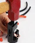 Hammer Lug Crimping Tool For 8 AWG Through 4 0 Battery And Welding Cables in use, crimping lug on a cable with red hammer